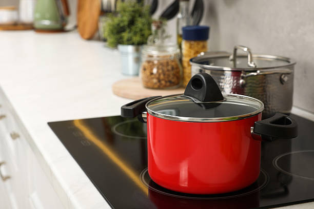 istock Cooking dinner. Pot on cooktop in kitchen 2206941611