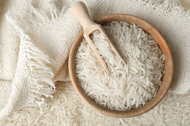 istock Raw basmati rice, bowl and scoop, top view 2206941635