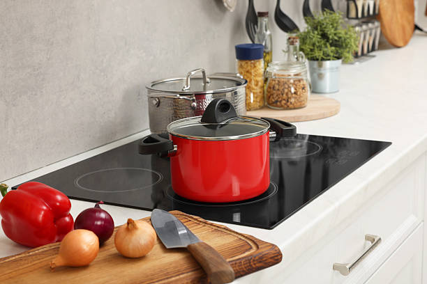 istock Cooking dinner. Pot and fresh vegetables on countertop in kitchen 2206941695