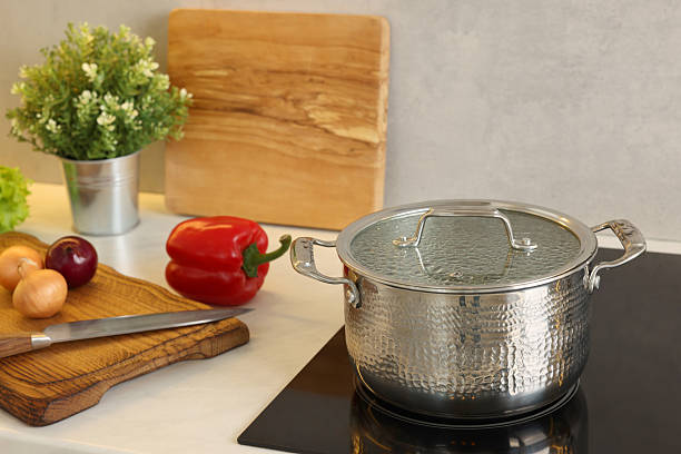 istock Cooking dinner. Pot and fresh vegetables on countertop in kitchen 2206941705