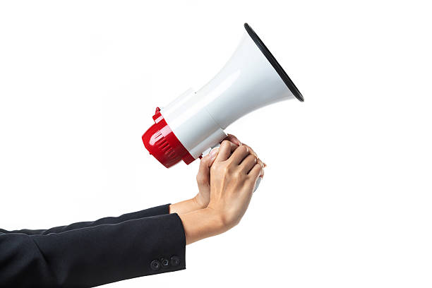 istock Close-up, woman hand holding megaphone isolated on white background. 2206944203