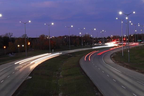 istock evening road light trails from cars, long exposure 2206947112