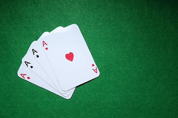 istock Poker game. Playing cards on green table, flat lay. Space for text 2206950104