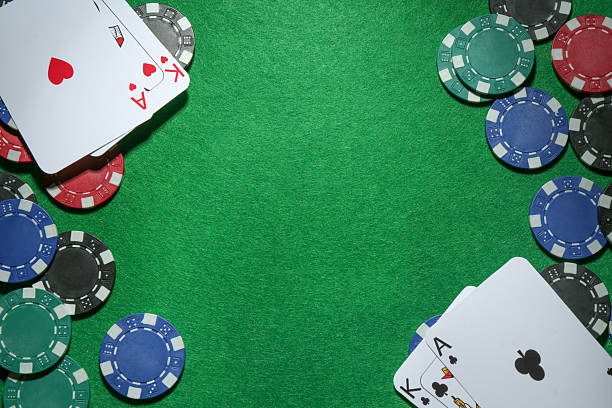 istock Frame of poker chips and playing cards on green table, flat lay. Space for text 2206950184