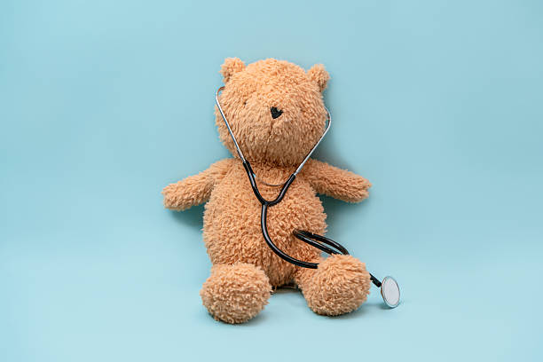 istock A stuffed bear toy with a stethoscope, a concept by pediatricians, on an isolated background 2206950744