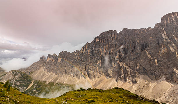 Landscape in the Dolomite Mountains, Italy, in summer, with dramatic storm clouds and Mount Civetta region
