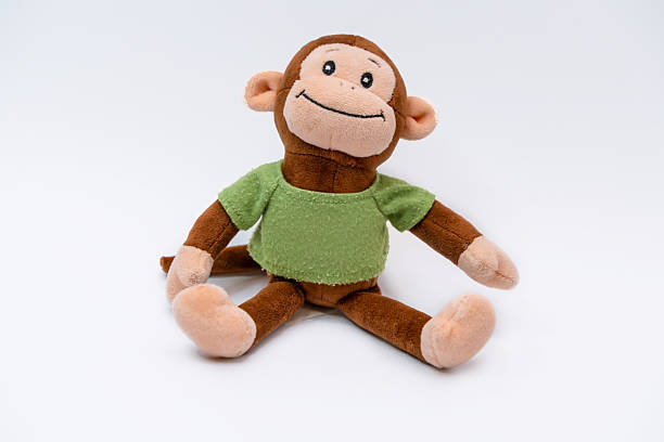 istock A stuffed monkey toy on an isolated background 2206950778