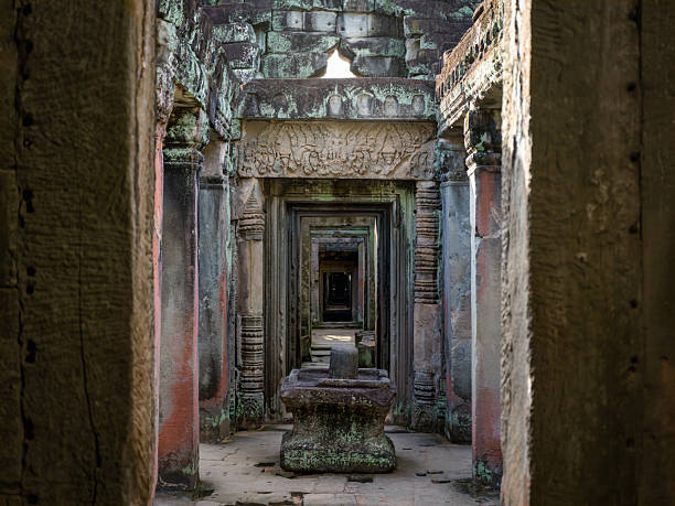 Green moss-covered stone building at Ta Prohm Tomb Raider temple complex. Angkor Wat historical site, Siem Reap, Cambodia