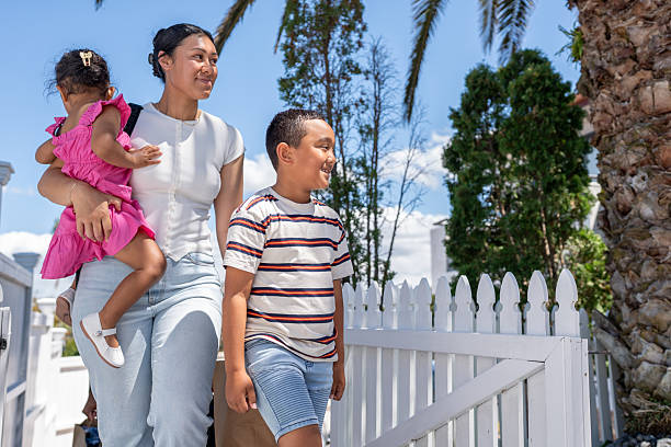istock Mother and Children Walking Together 2206956944