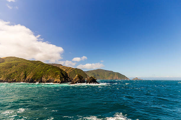 istock Rugged Island Amidst Turbulent Blue Waters 2206957134