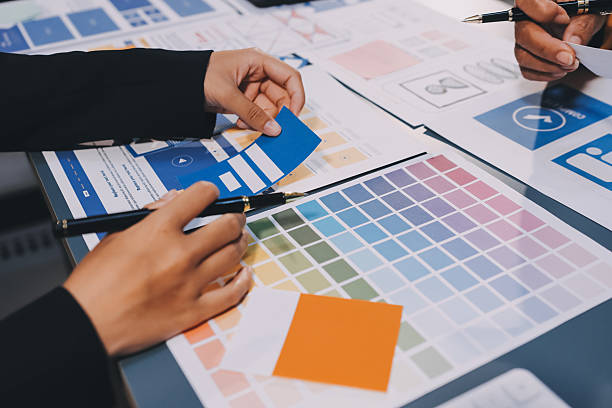 istock The designer team is designing the uxui system to make the uxui system work well on new phones and support system updates. Website development concept UI UX front end designer 2206959440