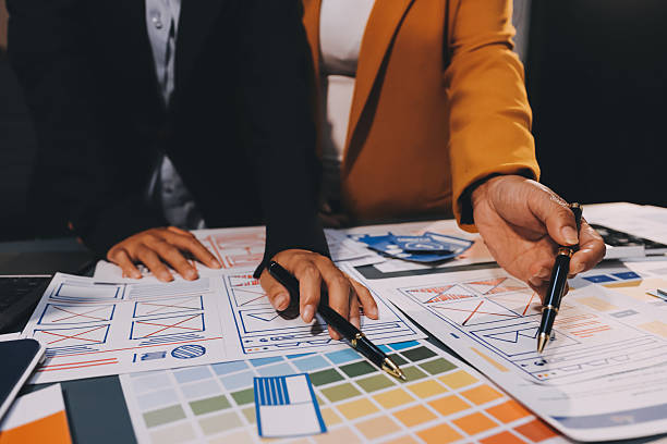 istock The designer team is designing the uxui system to make the uxui system work well on new phones and support system updates. Website development concept UI UX front end designer 2206959523