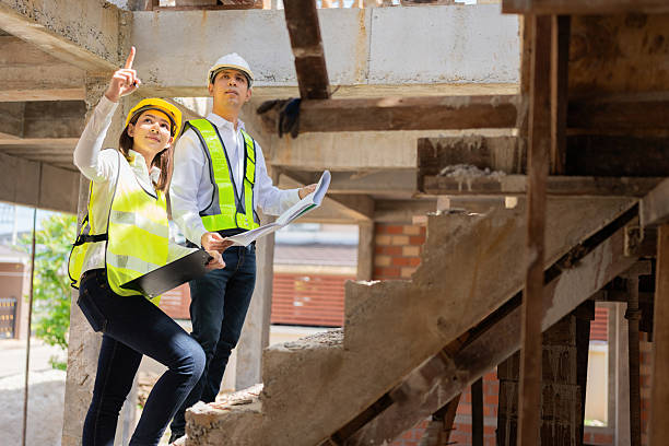 istock The construction industry benefits from two Asian male and female engineers who develop detailed blueprints and advanced architecture to support growing housing businesses worldwide. 2206960068