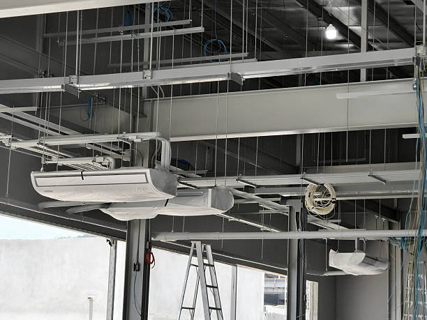 istock The ceiling of a large building under construction an extensive network of pipes 2206960152
