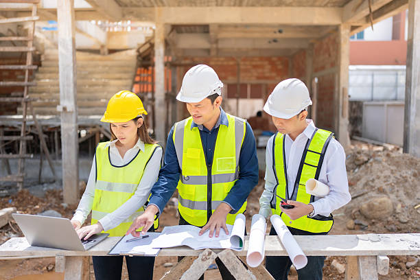 istock The construction industry benefits from three Asian male and female engineers who develop cutting-edge architecture and blueprints to improve housing businesses worldwide. 2206960199