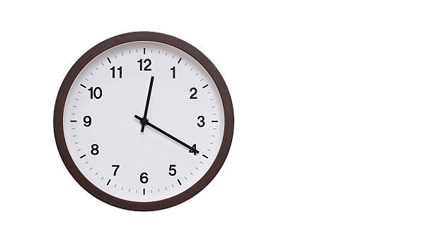 istock A simple round wall clock with a dark brown frame and a white face displaying 12.20/00.20. Isolated on a white background, perfect for time-related concepts, deadlines, and schedule themes. 2206961184