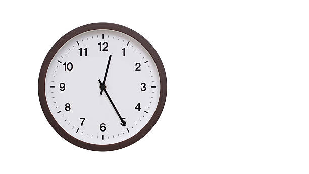 istock A simple round wall clock with a dark brown frame and a white face displaying 00.25/12.25. Isolated on a white background, perfect for time-related concepts, deadlines, and schedule themes. 2206961190