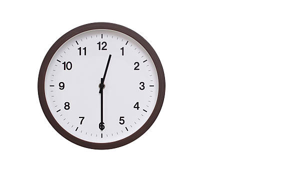 istock A simple round wall clock with a dark brown frame and a white face displaying 00.30/12.30. Isolated on a white background, perfect for time-related concepts, deadlines, and schedule themes. 2206961197