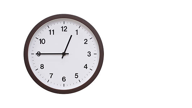 istock A simple round wall clock with a dark brown frame and a white face displaying 00.45/12.45. Isolated on a white background, perfect for time-related concepts, deadlines, and schedule themes. 2206961205