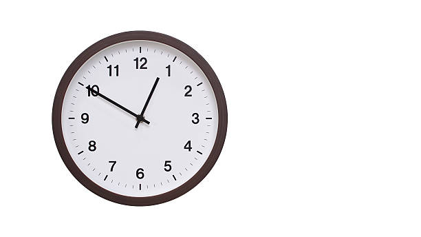 istock A simple round wall clock with a dark brown frame and a white face displaying 00.50/12.50. Isolated on a white background, perfect for time-related concepts, deadlines, and schedule themes. 2206961207