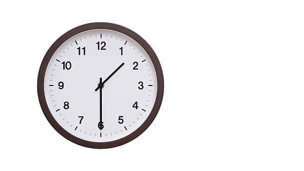 istock A simple round wall clock with a dark brown frame and a white face displaying 13.30/01.30. Isolated on a white background, perfect for time-related concepts, deadlines, and schedule themes. 2206961218