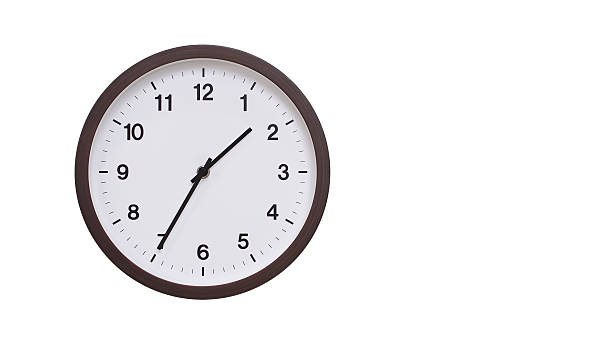 istock A simple round wall clock with a dark brown frame and a white face displaying 13.35/01.35. Isolated on a white background, perfect for time-related concepts, deadlines, and schedule themes. 2206961223