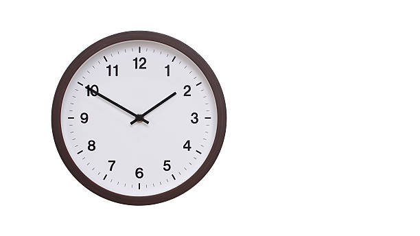 istock A simple round wall clock with a dark brown frame and a white face displaying 13.50/01.50. Isolated on a white background, perfect for time-related concepts, deadlines, and schedule themes. 2206961230
