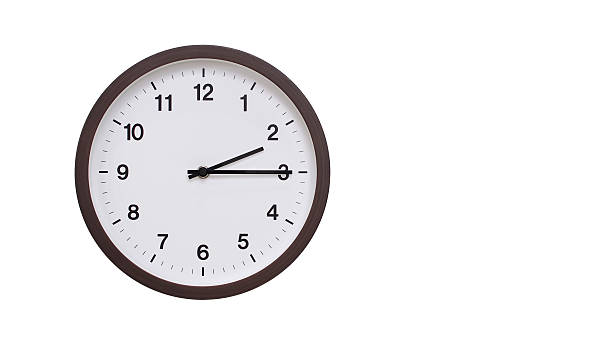 istock A simple round wall clock with a dark brown frame and a white face displaying 14.15/02.15. Isolated on a white background, perfect for time-related concepts, deadlines, and schedule themes. 2206961239