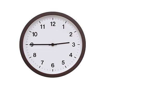istock A simple round wall clock with a dark brown frame and a white face displaying 14.45/02.45. Isolated on a white background, perfect for time-related concepts, deadlines, and schedule themes. 2206961247