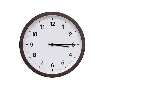 istock A simple round wall clock with a dark brown frame and a white face displaying 15.15/03.15. Isolated on a white background, perfect for time-related concepts, deadlines, and schedule themes. 2206961262