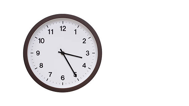 istock A simple round wall clock with a dark brown frame and a white face displaying 15.25/03.25. Isolated on a white background, perfect for time-related concepts, deadlines, and schedule themes. 2206961267