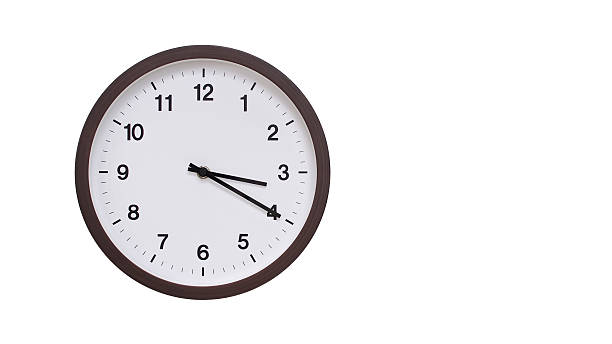 istock A simple round wall clock with a dark brown frame and a white face displaying 15.20/03.20. Isolated on a white background, perfect for time-related concepts, deadlines, and schedule themes. 2206961270