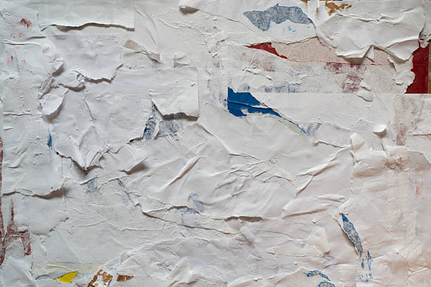 istock Collage of torn white, red, blue and yellow paper texture 2206961663