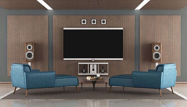 istock Modern home theater with large screen tv and blue chaises 2206961796
