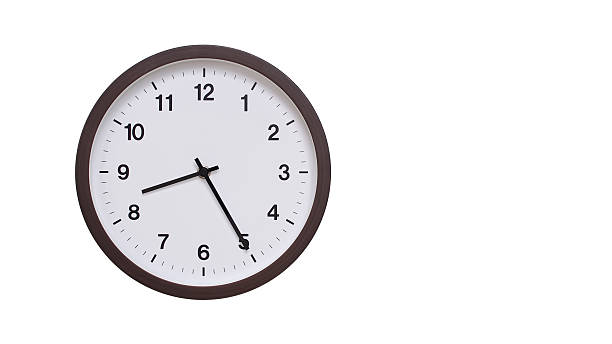 istock A simple round wall clock with a dark brown frame and a white face displaying . Isolated on a white background, perfect for time-related concepts, deadlines, and schedule themes. 2206962007