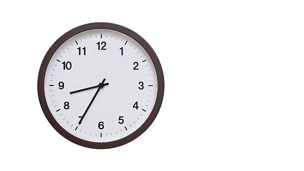 istock A simple round wall clock with a dark brown frame and a white face displaying 20.35/08.35. Isolated on a white background, perfect for time-related concepts, deadlines, and schedule themes. 2206962053
