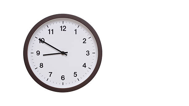 istock A simple round wall clock with a dark brown frame and a white face displaying 20.50/08.50. Isolated on a white background, perfect for time-related concepts, deadlines, and schedule themes. 2206962058