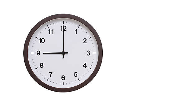 istock A simple round wall clock with a dark brown frame and a white face displaying 21.00/09.00. Isolated on a white background, perfect for time-related concepts, deadlines, and schedule themes. 2206962067