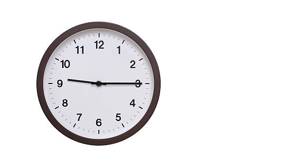 istock A simple round wall clock with a dark brown frame and a white face displaying 21.15/09.15. Isolated on a white background, perfect for time-related concepts, deadlines, and schedule themes. 2206962074