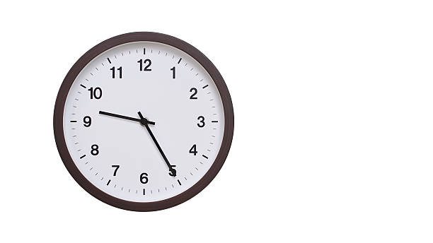 istock A simple round wall clock with a dark brown frame and a white face displaying 21.25/09.25. Isolated on a white background, perfect for time-related concepts, deadlines, and schedule themes. 2206962094