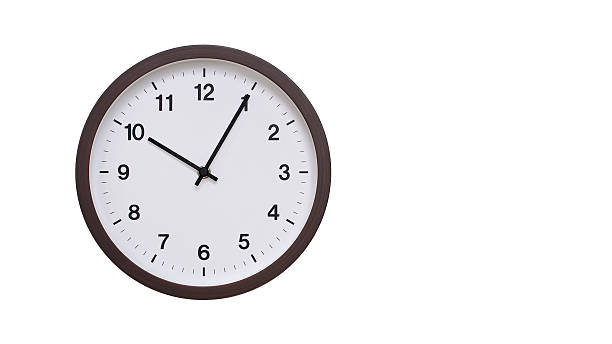 istock A simple round wall clock with a dark brown frame and a white face displaying 22.05/10.05. Isolated on a white background, perfect for time-related concepts, deadlines, and schedule themes. 2206962136