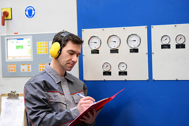 istock industrial workers inspect the technology of a plant for function - assembler in working clothes 2206962138