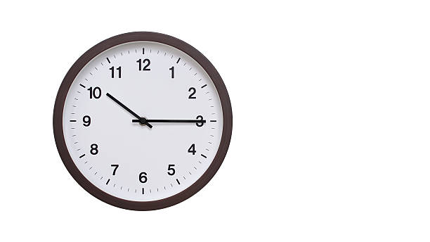 istock A simple round wall clock with a dark brown frame and a white face displaying 22.15/10.15. Isolated on a white background, perfect for time-related concepts, deadlines, and schedule themes. 2206962167