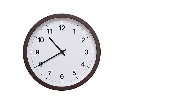 istock A simple round wall clock with a dark brown frame and a white face displaying 10.40/22.40. Isolated on a white background, perfect for time-related concepts, deadlines, and schedule themes. 2206962169