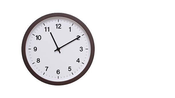 istock A simple round wall clock with a dark brown frame and a white face displaying 11.10/23.10. Isolated on a white background, perfect for time-related concepts, deadlines, and schedule themes. 2206962197