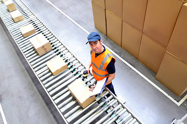 istock workers in a goods warehouse - storage and transport of goods by mail order 2206962642