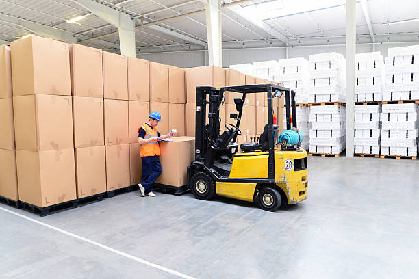 istock workers in a goods warehouse - storage and transport of goods by mail order 2206962910