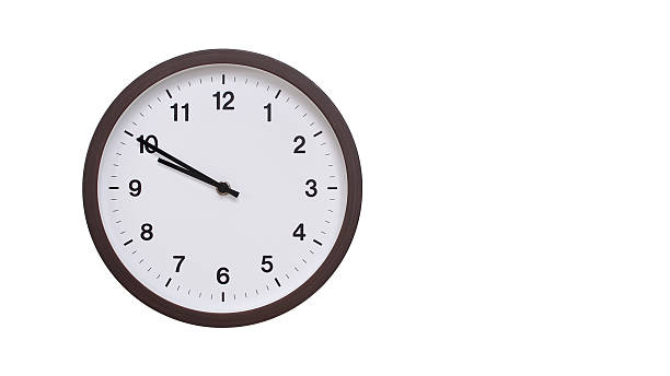 istock A simple round wall clock with a dark brown frame and a white face displaying 21.50/09.50. Isolated on a white background, perfect for time-related concepts, deadlines, and schedule themes. 2206963072