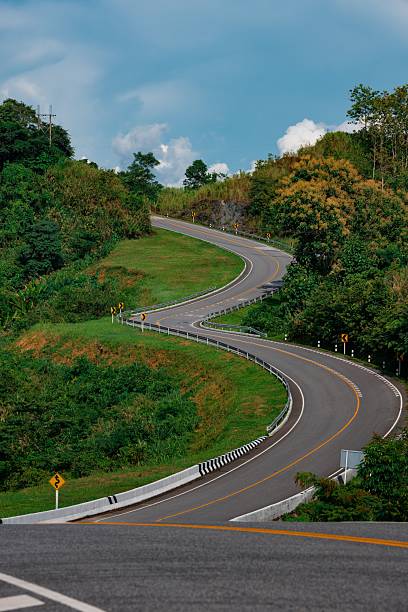 istock Scenic Winding Road through Green Hills 2206964924