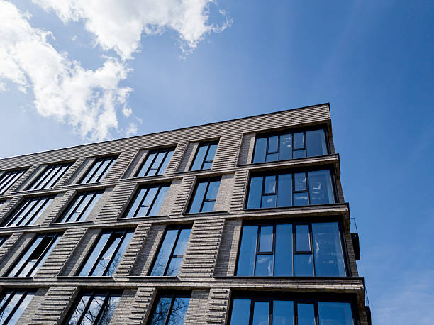 istock brick apartment building against the blue sky 2206969352